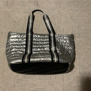THINK ROYLN Silver Quilted Tote with black, white and silver striped handles.